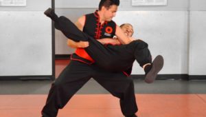 Image of Donald Tittle, a Combat Kung-Fu Instructor & 6th Generation Choy Li Fut Master, Applying a Take-Down Technique